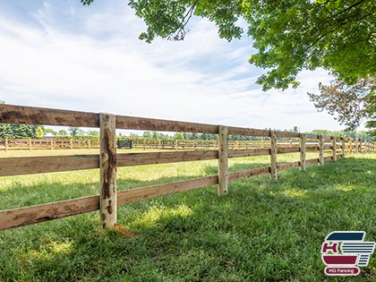 Wooden farm fence and field fencing