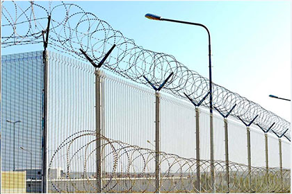 Concertina razor barbed wire installed on top of Anti Climb Fence