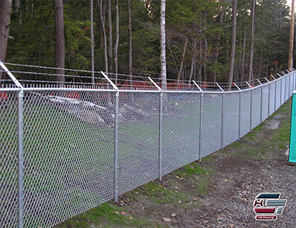 Chain link fence with barbed wire