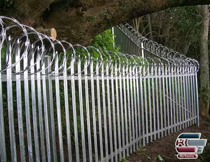 Concertina razor wire mounted on top of Palisade Fence