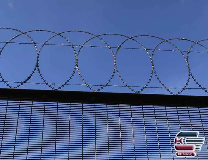 Concertina razor wire installed on top of 358 anti-climb fence