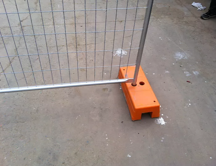 Temporary fence with concrete-filled plastic base